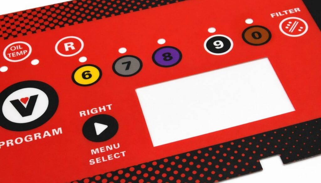 Red polycarbonate control panel overlay manufactured by Metallics, Inc. with color-coded numbered buttons, oil temperature and filter icons, menu controls, and a display cutout.